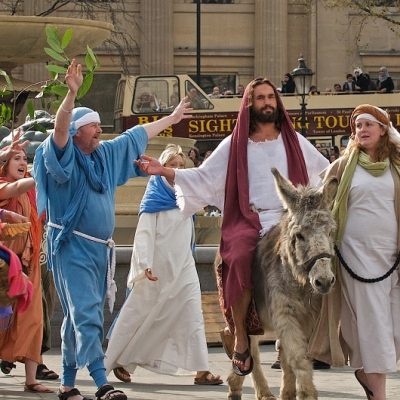 Riding on a donkey into Jerusalem